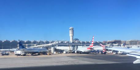 An airport with many airplanes parked on tarmac